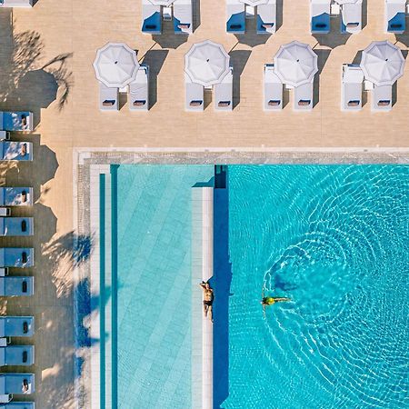 Ivi Mare - Designed For Adults By Louis Hotels Geroskipou المظهر الخارجي الصورة Aerial view of the pool at the Hotel du Cap-Eden-Roc, Cap d'Antibes, France